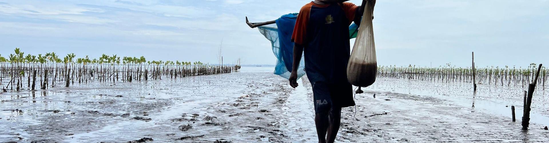 Man walking in shallow water
